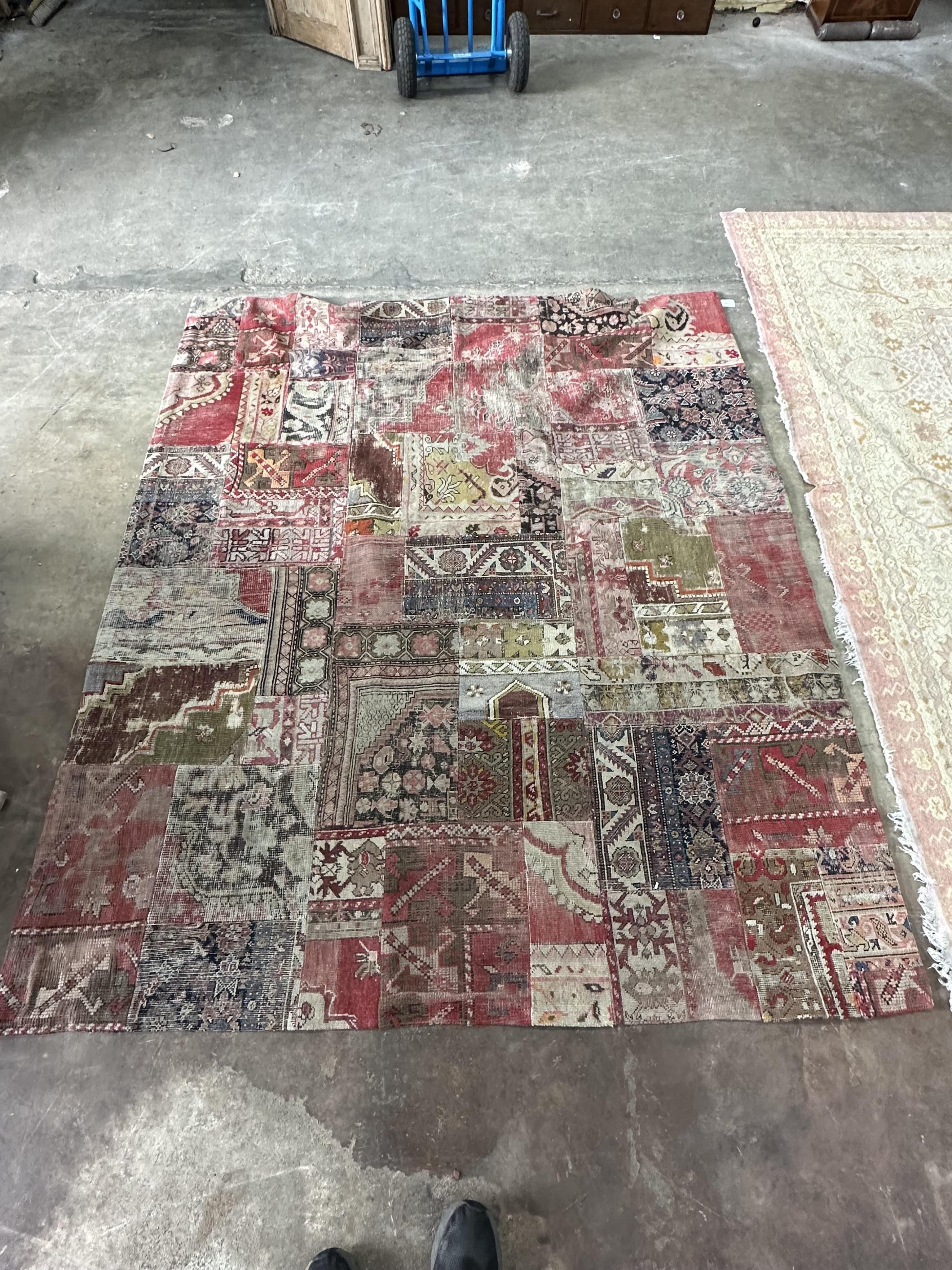 An EthniCon Turkish patchwork rug made from antique carpet fragments, approximately 360 x 200cm. Condition - fair